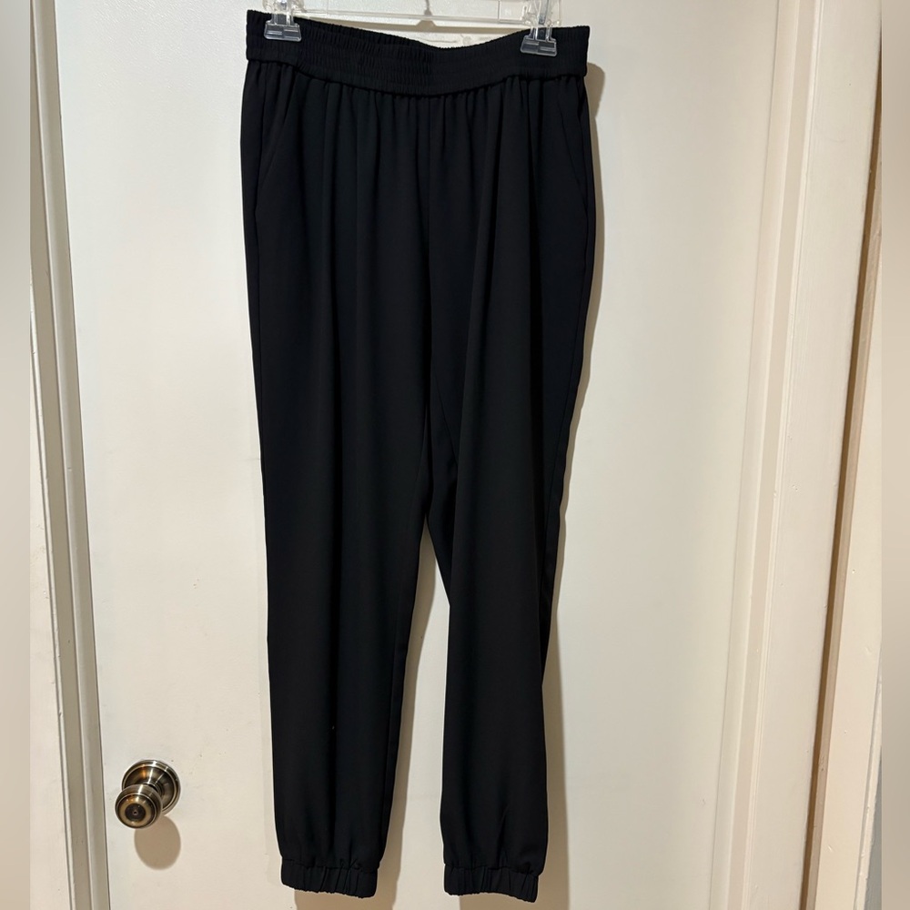 Black Women's Jogger Pants with side pockets and elasticized waist and cuffs.